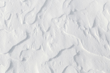 Fresh snow background - windswept, abstract, sculpted, packed snow