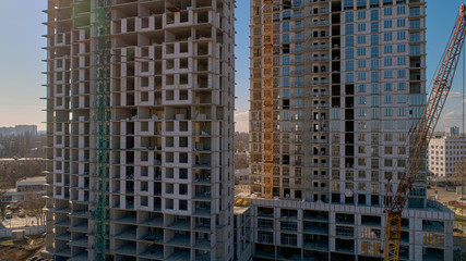 Fototapeta na wymiar Construction of high-rise residential building. Aerial view of construction of high-rise apartment building.