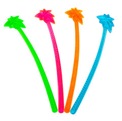 Isolated red, green, orange and blue plastic palm tree cocktail stirrers.