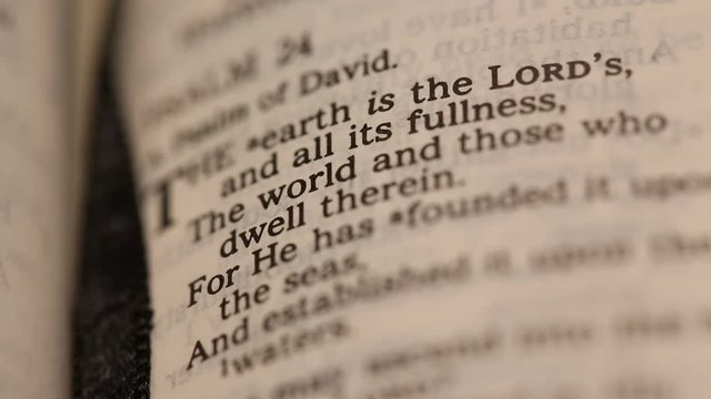 Extreme Close Up Of Bible Verse Psalm 24 With Shallow Focus