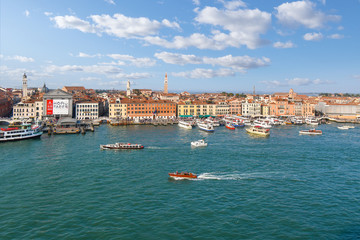 Birds eye view of the Grand Canal and Giudecca Canal with many boats in the lagoon at Venice, Italy.