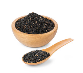 Black sesame seeds in wooden spoon and wooden bowl  isolated on white background