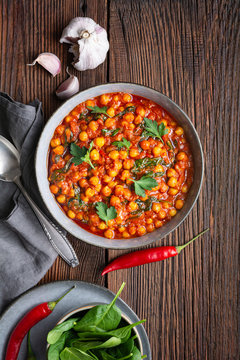 Indian meal, spicy chickpea curry with spinach in a bowl