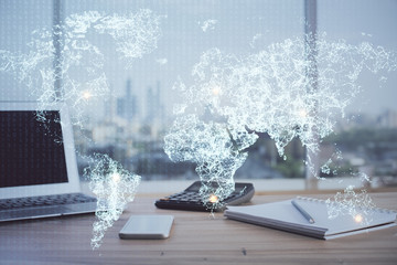 Computer on desktop with social network hologram. Multi exposure. Concept of international people connections.