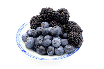 Blueberry and Blackberry on blown cup with white background, fruit concept