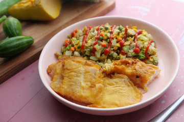 fish fillet and salad on plate for healthy diet 