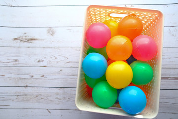 top view of colorful plastic ball in a box 
