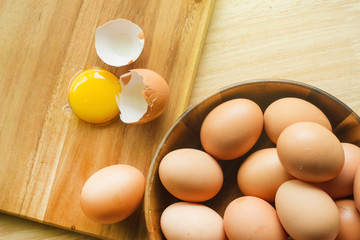 Fresh farm eggs on a wooden rustic background. chicken eggs on the table. Farm products, natural...