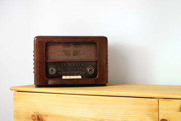 Vintage radio made of wood on a table