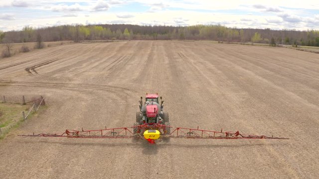 tractor crop dusting close up