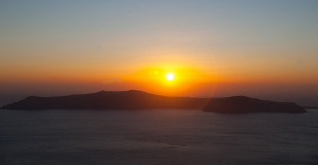 Sunset Over Island From Santorini Greece
