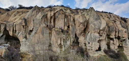 Goreme valley with ancient chapels carved into hillside, Cappadocia, Turkey