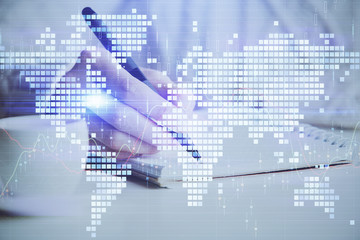 Obraz premium International business hologram over woman's hands taking notes background. Concept of success. Double exposure