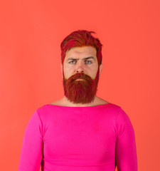 Advertising and barber shop concept. Hairstyle. Serious man with dyed beard and hair. Hipster with pink hair. Hairstylist. Bearded man with colored hair. Man with creative painting hair and hairstyle.