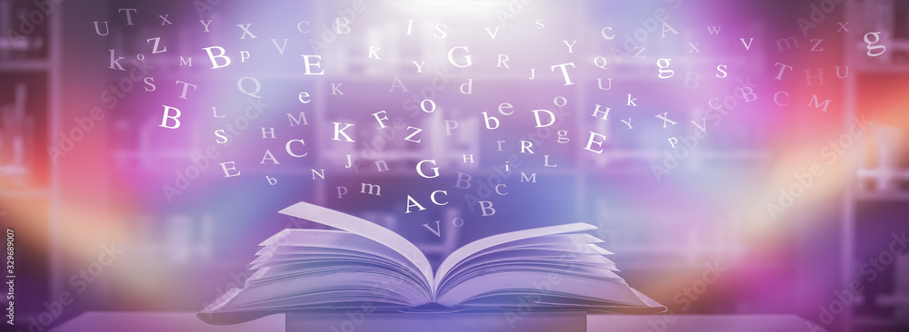 Poster imagine opening an old book blurred with magic power on the table and the english alphabet floating 