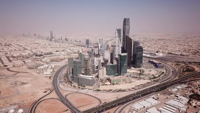 Flying towards skyscrapers and offices in King Abdullah Financial District (partly under construction) in Riyadh, Saudi Arabia