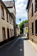 Germany, Moselkern Forest, a narrow street in front of a brick building