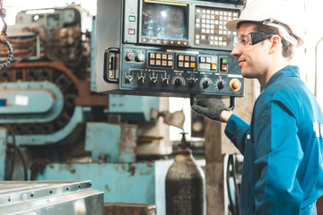 Industrial Engineers in Hard Hats.Work at the Heavy Industry Manufacturing Factory.industrial worker indoors in factory. man working in an industrial factory.