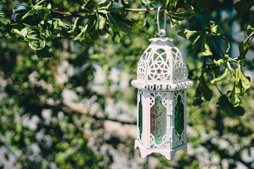 Arabic lantern on the nature background. Ramadan Kareem concept. © ibnu
