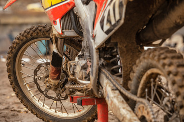 Close-up of the  wheel of a racing cross-country motorcycle after the race. Lifestyle. Moto sport.