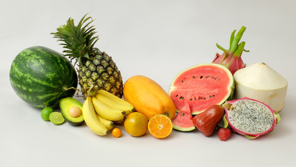 Close up view of assortment of exotic fruits and copy space on white background