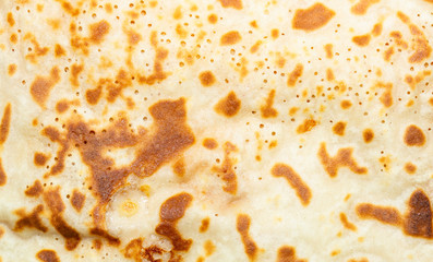 Fried pancakes. The texture of the dough. A treat on Shrove Tuesday. Culinary product.