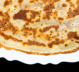 Fried pancakes. The texture of the dough. A treat on Shrove Tuesday. Culinary product.