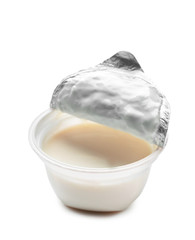 Plastic cup with tasty yogurt on white background