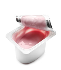 Plastic cup with tasty yogurt on white background