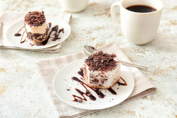 Plate with tasty cake on white background