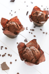 Tasty chocolate muffins on table