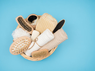 Accessories in the basket to care for beautiful skin on a blue background.