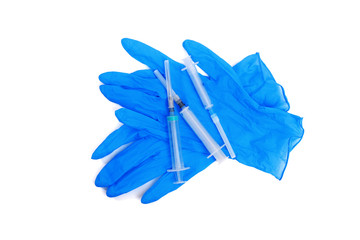 top view on disposable medical gloves and syringe isolated on white background