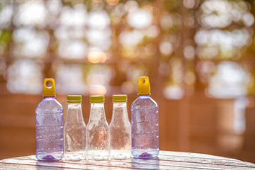 Blurred background view of modern design perfume bottles placed on the table, sales and beauty business concept