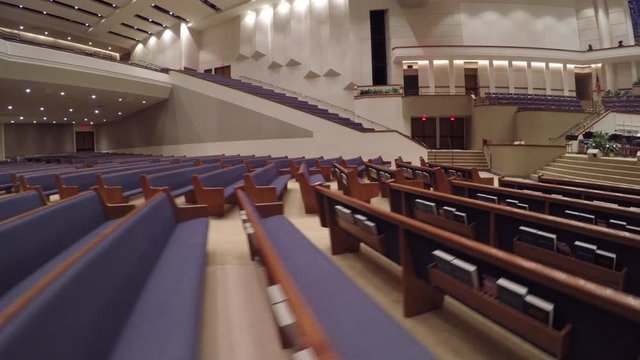 Large Church Sanctuary Moving Forward Over Pews