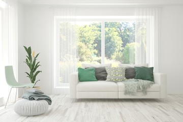 Minimalist living room in white color with sofa and summer landscape in window. Scandinavian interior design. 3D illustration