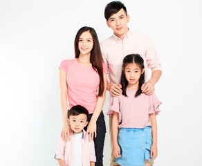 Obraz premium happy young asian family standing before white background