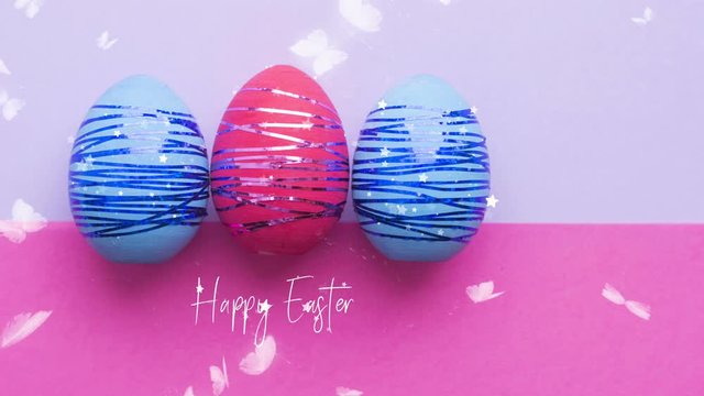 Easter eggs on a bright colored background, white butterflies flying around. The concept of Easter.