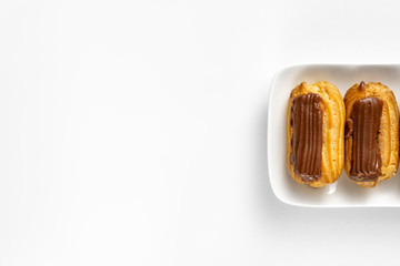 fragment cakes chocolate icing on white background