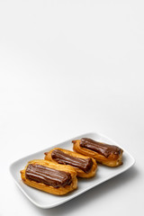 cakes chocolate icing and coffee white background