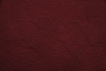 Fototapeta premium Beautiful abstract grunge decorative relief dark red background. Rough stylized stucco wall texture. Web banner with red surface for design.