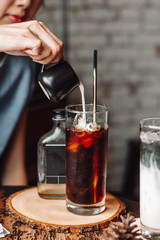 iced coffee cube in glass with milk