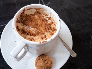 Sahlep or Salep Turkish winter beverage drink with cinnamon. Selective focus.