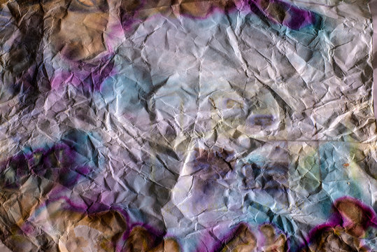 Texture of colored and crumpled paper. © Омурали Тойчиев