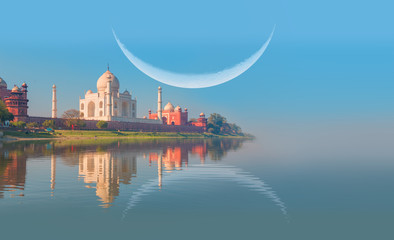 Taj Mahal with crescent moon at sunset  - Agra, India
