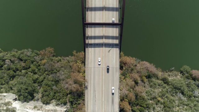 Aerial view of cars driving over the The Percy V. Pennybacker Jr. Bridge in Austin, Texas. This video was filmed in 4k for best image quality.
