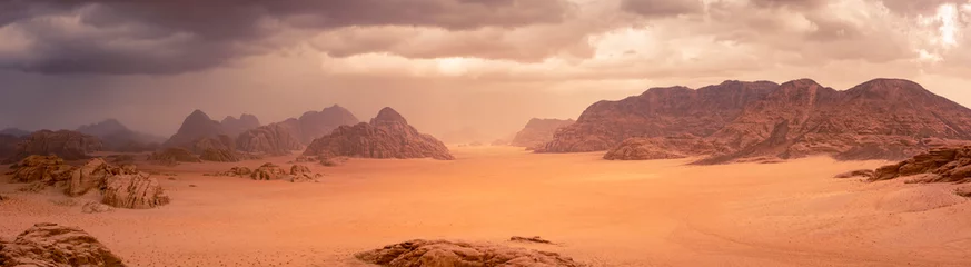 Fotobehang Diepbruin Wadi Rum desert in Jordan under dramtic rain and storm clouds. Panorama picture  © Kristof