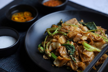 Thai food - Stir fried rice noodle with soy sauce. It’s called “Pad See Ew” in Thai language.
