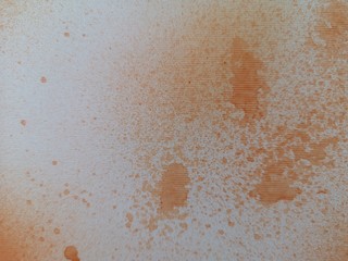 spray orange on Corrugated paper Abstract color wallpaper Graphic arts paper background, gradient dot texture