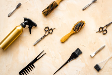 Hairdresser tools pattern on beige background top-down